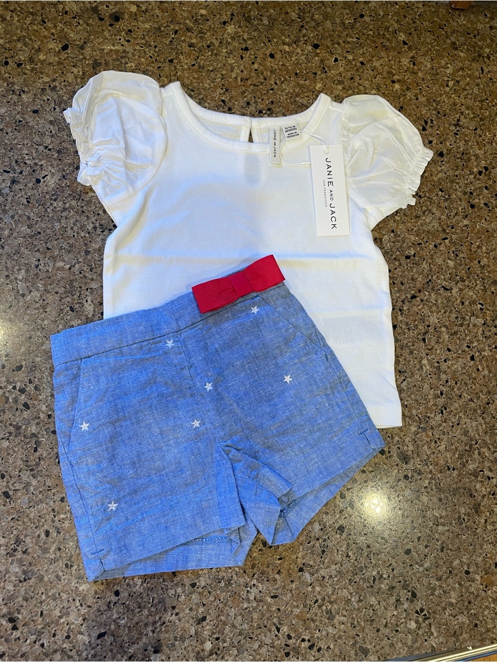 Janie and Jack White Top with Blue Star Shorts and Red Bow